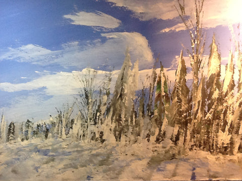 Snow-beaten trees along the lakeshore